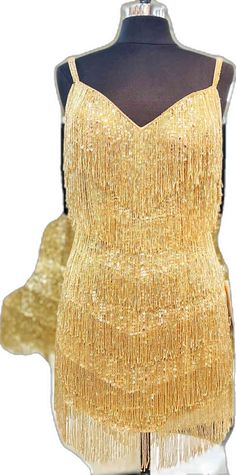 Glamorous Gold Flapper Dress For Summer, Gold Fringe Party Dress, Gold Fringe Dress For Party, Gold Sleeveless Flapper Dress For Night Out, Gold Sleeveless Flapper Dress For Party Season, Glamorous Gold Dress With Fringe, Glamorous Gold Fringe Dress, Gold Fringe Dress For Party Season, Fitted Gold Sleeveless Flapper Dress