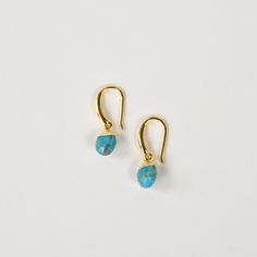 Turquoise Drop Earrings - Goldmakers Fine Jewelry Turquoise Brass Earrings As Gift, Turquoise Brass Earrings For Gift, Turquoise Dangle Jewelry With French Hook, Turquoise Jewelry With French Hook For Gift, Turquoise Teardrop Brass Jewelry, Gift Turquoise Brass Earrings, Turquoise Brass Jewelry With Ear Wire, Turquoise 14k Gold-filled Earrings With Ear Wire, Turquoise Gold-plated Earrings For Gifts