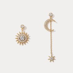 Invite the sun and the moon into your life with these Moon & Sun Earrings. A luxurious and exclusive pair of earrings, this unique design offers a sophisticated and tasteful accessory to its wearer. Handcrafted with exquisite detail, these earrings will add a subtle shine to brighten any day. DETAILS Plating: 18K Gold Materials: 18K Gold on Brass, Cubic Zirconia Size: 2.76"*0.79"(70mm*20mm) Weight: 4g Luxury Moon Charm Round Earrings, Luxury Moon Charm Earrings, Luxury Earrings With Moon Charm, Luxury Jewelry With Sun And Moon Design, Luxury Moon-shaped Celestial Earrings, Luxury Gold Moon-shaped Earrings, Luxury Sun And Moon Design Jewelry, Luxury Gold Earrings With Moon Charm, Luxury Moon Charm Formal Jewelry