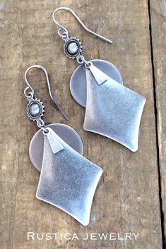 Antiqued silver geometric dangle earrings. #SilverBohoDangleEarrings #SilverGeometricJewelry #AntiquedSilverJewelry #SouthwesternInspiredJewelry #Westernsilverearrings #Bohoearrings #Bohochicjewelry #Giftsforher #Bohobridesmaidgifts #BohoBridejewelry #Silverhandmadejewelry Nickel Free Silver Southwestern Earrings, Silver Bohemian Earrings For Everyday, Bohemian Silver Earrings For Everyday, Southwestern Style Metal Drop Earrings, Southwestern Silver Earrings With Oxidized Finish, Bohemian Geometric Earrings With Ear Wire, Handmade Silver Geometric Earrings, Bohemian Geometric Nickel-free Jewelry, Dangle Earrings Silver