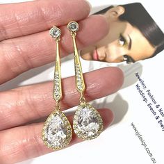 "A pair of linear drop dangle cz drop 1920s vintage style Art Deco bridal earrings with pave bar posts and clear cubic zirconia teardrop dangles. These dainty but stunning and lightweight jewelry in a choice of 3 tarnish-resistant plating; silver rhodium, yellow gold or rose gold. Earrings are about 2\" (5cm) including posts. View all earrings at http://etsy.me/1f8VFT4" Glamorous Drop Chandelier Earrings For Anniversary, Classic Drop Crystal Earrings For Party, Classic Drop Chandelier Earrings For Wedding, Gold Long Drop Bridal Earrings, Gold Long Drop Bridal Earrings For Formal Occasion, Classic Gold Drop Chandelier Earrings, Classic Teardrop Bridal Earrings For Party, Classic Chandelier Dangle Earrings For Wedding, Vintage Teardrop Bridal Earrings For Wedding