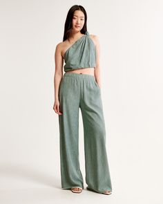 Ultra high rise ultra-wide leg pants in a breezy, crinkle textured fabric, featuring a pull-on style elasticated waistband for comfort and adjustability. Chic Flowy Green Bottoms, Chic Green Flowy Bottoms, Spring Wide-leg Pants With Crinkle Texture, Casual Summer Pants With Crinkle Texture, Spring Wide-leg Crinkle Texture Pants, Summer Loungewear Bottoms With Crinkle Texture, Summer Wide Leg Bottoms With Crinkle Texture, Summer Loungewear Pants With Crinkle Texture, Summer Wide Leg Pants With Crinkle Texture