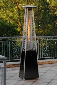 an outdoor patio heater sitting on the ground