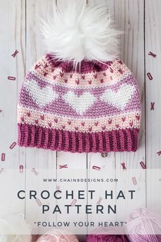 the crochet hat pattern is shown with balls of yarn in front of it