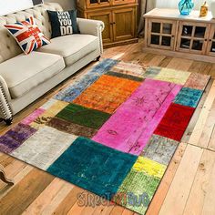 a living room filled with furniture and colorful rugs