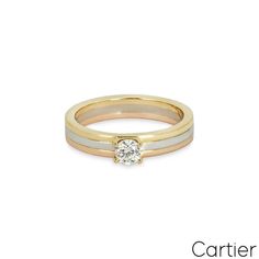 For Sale on 1stDibs - A gorgeous 18k tri-colour gold diamond ring by Cartier from the Trinity de Cartier collection. The ring is set to the centre with a 0.24ct round brilliant Cartier White Diamond Ring With Accents, White Cartier Diamond Ring With Accents, Timeless Cartier Diamond Ring Round Cut, Cartier Diamond Ring Brilliant Round Cut, Timeless Cartier Round Cut Diamond Ring, Timeless Cartier Diamond Ring With Round Cut, Cartier Diamond Ring With Round Band, Cartier White Diamond Ring Round Cut, Cartier White Diamond Round Cut Ring