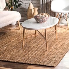 a living room with two chairs and a coffee table