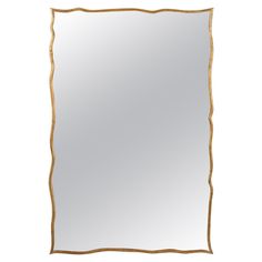 a gold framed mirror on a white background