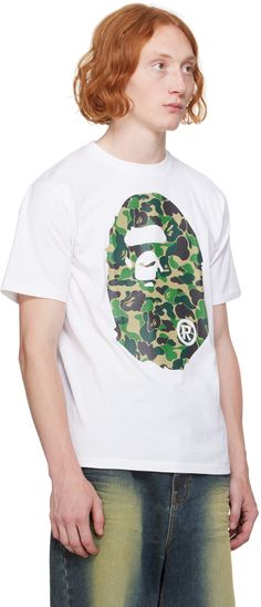 Cotton jersey T-shirt. · Rib knit crewneck · Logo graphic printed at front and back · Logo flag at cuff Supplier color: White X green Camouflage Letter Print T-shirt For Streetwear, Camouflage Graphic Print Crew Neck T-shirt, Green Crew Neck T-shirt With Letter Print, Relaxed Fit Camouflage T-shirt With Graphic Print, Camouflage Graphic Print T-shirt For Streetwear, Camouflage Graphic Tee For Streetwear, Camouflage Crew Neck T-shirt With Graphic Print, Casual Camouflage T-shirt For Streetwear, Camouflage Sublimation Print Crew Neck T-shirt