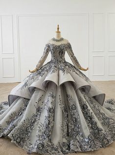 a ball gown with grey and white flowers on it