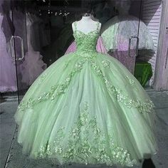 Green Quinceanera Dresses Princess And The Frog, Light Green Sweet Sixteen Dress, Quinceanera Dress Sage Green, Light Green Poofy Dress, Light Green Xv Dresses, Green Dress For Sweet 16, Green Floral Quinceanera Dresses, Light Green Ball Gown Princesses, Tiana Theme Quinceanera