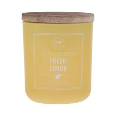 a yellow candle with a wooden lid and label on it that says fresh lemon in front of a white background