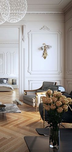 a living room filled with furniture and flowers