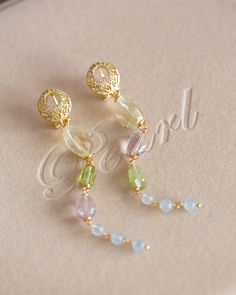 Crafted from the finest materials, these elegant earrings are a charming combination of 14K gold filled wires and a selection of luxurious gemstones, including Lemon Quartz, Amethyst, Peridot, and Aquamarine. Suspended from a pair of cubic ear hoops, they offer a unique accent to your everyday wardrobe or a thoughtful gift for someone special. Images cannot capture their beauty - you must see them in person to appreciate their grandeur. Follow me on Instagram: @cubic_jewels Special Images, Wedding Jewelry Earrings, Lemon Quartz, Etsy Earrings Dangle, Elegant Earrings, Wedding Earrings, Aquamarine, Thoughtful Gifts, Wedding Jewelry