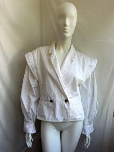 Vintage white fitted jacket from Jil Sander. Sleeves with lace up. The oversized fit and drop shoulders Size 38 tag, fits like S-L Condition 6/10 (last photo) Underarm to underarm - cm/" Length from the back - cm/" Sleeve length from seam - cm/" Sleeve length from collar - cm/" Waist - cm/" 📍 follow the shop on Instagram: @𝚔𝚘𝚛𝚊𝚛𝚎_𝚟𝚒𝚗𝚝𝚊𝚐𝚎 All measurements taken with garment lying flat.  Vintage sizes vary greatly! We recommend comparing measurements with a similar style garment you Vintage White Blazer For Winter, Vintage White Winter Blazer, White Cotton Button-up Blazer, White Lapel Collar Top For Winter, Vintage White Long Sleeve Blazer, Casual Oversized White Blazer, Casual White Oversized Blazer, White Vintage Outerwear For Spring, White Lapel Collar Top For Spring