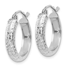 Rhodium over 14k white gold diamond-cut hoop earrings. Measure approximately 11/16"L x 1/8"W and have saddleback backings. White Diamond Cut Huggie Jewelry, Classic Sterling Silver Hoop Earrings With Diamond Cut, Classic Sterling Silver Diamond Cut Hoop Earrings, White Diamond Cut Hoop Jewelry, Silver Diamond Cut Huggie Jewelry, Sterling Silver Hoop Jewelry With Diamond Cut, Oval Sterling Silver Hoop Earrings With Diamond Cut, Oval Diamond Cut Sterling Silver Hoop Earrings, Sterling Silver Hoop Earrings With Diamond Cut