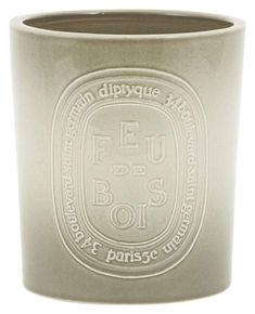 a white cup with the words feu de bos on it