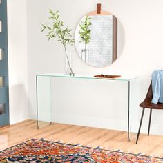 This clean-lined console table keeps sightlines clear in your living room or entryway. It pairs a waterfall silhouette with a see-through, barely-there design made from tempered glass for a statement piece inspired by mid-century furniture. We love how there's plenty of space underneath to tuck away bags, baskets, and even shoe organizers. On the surface, this piece accommodates a vase of fresh flowers and a tray for mail and keys. But the best part? This table arrives fully assembled - you just Shoe Organizers, Glass Console Table, Shoe Organizer, Century Furniture, Mid Century Furniture, Joss And Main, Accent Furniture, Fresh Flowers, Console Table