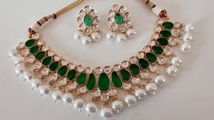 Premium Polki Kundan Stone Double Layer Necklace with Earrings Arrives in a gift box! Plating: anti-tarnish Moissanite polki Stone: It has an Excellent Lustre of Moissanite Polkis which are the best substitute for Real Polkis. Green Emerald Kundan Necklace As A Gift, Green Emerald Kundan Necklace For Gift, Kundan Emerald Gemstone Necklace As A Gift, Kundan Emerald Necklace As Gift, Gift Kundan Emerald Necklace, Hand Set Round Kundan Necklace Gift, Green Kundan Emerald Necklace For Gift, Gift Emerald Kundan Necklace, Hand-set Round Kundan Necklace Gift