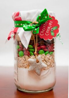 a glass jar filled with cookies and candy