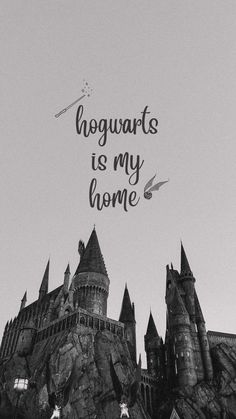 hogwart's is my home on the side of a castle in black and white