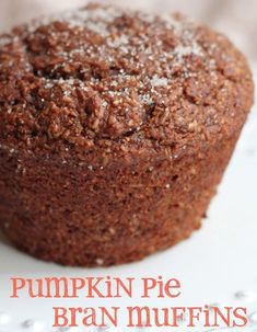 a close up of a muffin on a plate with the words pumpkin pie bran muffins