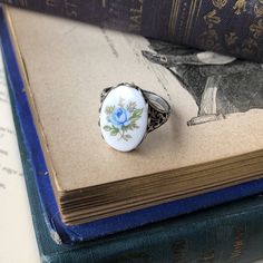 Victorian style antiqued ring which is fully adjustable.At its center is an 18x13mm vintage blue rose cameo.Available in both antiqued brass and antiqued silver. Cameo Rings Vintage, Vintage Cameo Rings For Collectors, Antique Silver Cameo Rings, Victorian Silver Cameo Jewelry, Victorian Silver Cameo Rings, Victorian Filigree, Victorian Vintage, Cameo Ring, Vintage Style Rings