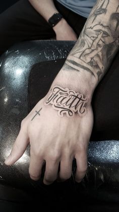 Hb hjnbbvgg Name Tattoos For Men Hand, Front Wrist Tattoos Men, Name Tattoos For Men Wrist, Men Lettering Tattoo, 2003 Hand Tattoo, Faith Tattoo Hand, Faith Tattoo For Men, Faith Fonts Tattoo, Hand Tattoos Text