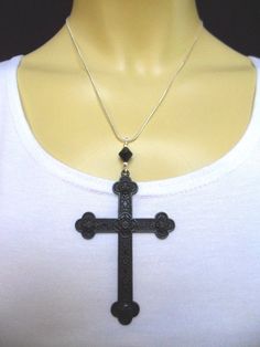 "This is a lovely black cross themed pendant necklace. The cross is approx. 8cm long x 5.5cm wide - so a good sized cross. On an 18\" silver plated snake chain. Thanks for looking!!" Handmade Black Crucifix Necklace, Black Metal Crucifix Cross Necklace, Black Metal Crucifix Necklace, Spiritual Black Sterling Silver Cross Necklace, Black Metal Cross Necklace, Handmade Black Cross Pendant Necklace, Handmade Black Cross Necklace, Black Cross Necklace, Egyptian Necklace