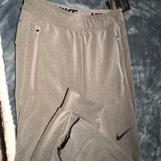 Brand New Sweat Pants Nike Gray Pants With Pockets, Nike Stretch Pants With Pockets, Nike Gray Functional Bottoms, Nike Stretch Joggers With Pockets, Gray Nike Sweatpants Men, Nike Moisture-wicking Sweatpants For Sports, Nike Moisture-wicking Functional Joggers, Gray Go-dry Sweatpants Sportswear, Nike Bottoms