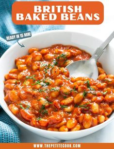 a white bowl filled with baked beans on top of a table