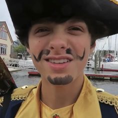 a young man with his face painted like a pirate