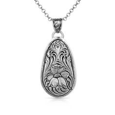 PRICES MAY VARY. Find the feeling of a field of blooming wildflowers with this incredible design. The pendant of the necklace is a silver tone oval shape that hangs from a 19 inch silver tone adjustable chain. Detailed engraving creates the necklace. Within the engraving is a large flower framed by whisps that add grace and elegance to the design. A deep antiquing brings out each intricate line in the engraving of the Wildflower Impressions Necklace. Silver Jewelry Necklace, Tractor Supply, Dream Jewelry, Large Flowers, Flower Frame, Jewelry Tutorials, Oval Shape, Tractor, Beautiful Necklaces