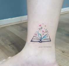 an open book tattoo on the ankle