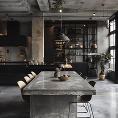 An industrial dining room with a sleek, polished concrete dining table, adding a modern, minimalist touch to the space2 Industrial Dining Room, Industrial Style Decor, Industrial Dining, How To Design, The Urban, Industrial Style, The Past, Dining Room, Design