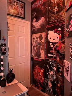 a room filled with posters and pictures on the wall