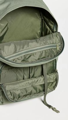 Fabric: 600D Polyester Canvas.Tonal design.Zip closure.Zip, slip, and patch interior and zip exterior pockets.Adjustable shoulder straps.Nylon lining.Weight: 21oz / 0.6kg.Imported, Vietnam Practical Nylon Backpack For Trips, Functional Backpack With Zipper Pocket For Trips, Functional Standard Backpack For Hiking, Functional Nylon Hiking Backpack, Functional Nylon Backpack For Hiking, Nylon Backpack With Pockets For Outdoor Activities, Green Nylon Bags With Pockets, Utility Backpack With Functional Pockets For Travel, Practical Nylon Backpack With Zipper Closure