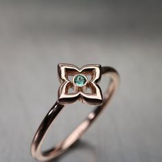 A delicate lucky clover ring to carry around a dose of fresh luck every day 🍀 The lovely rose gold color in combination with the vibrant green of a genuine emerald makes for a perfect gift. The green variety of beryl is May's birthstone.Made from 14k rose gold and a 2mm clear brilliant-cut emerald.The clover measures 9.8mm.Ring Width: 1.4mmRing Thickness: 1.4mm**Made to order in your size (please allow 5-7 days)nangijalajewelry.etsy.com*For your own protection and in order to comply with Etsy's Luxury Rose Gold 14k Gold Emerald Ring, Fine Jewelry Rose Gold May Birthstone Ring, Fine Jewelry Rose Gold Birthstone Ring For May, Rose Gold May Birthstone Ring In Fine Jewelry Style, Rose Gold Fine Jewelry Birthstone Ring For May, Elegant Rose Gold Flower Ring With Birthstone, Dainty Rose Gold May Birthstone Ring, Gift Rose Gold 14k Emerald Ring, 14k Rose Gold Fine Jewelry Birthstone Ring