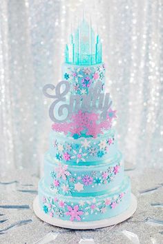 there is a cake that has been decorated with stars and sparkles on the table