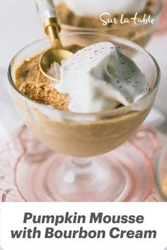 pumpkin mousse with bourbon cream in a glass bowl on a pink plate and text overlay that reads, pumpkin mousse with bourbon cream