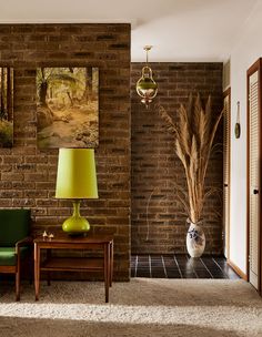 a living room filled with furniture and a lamp