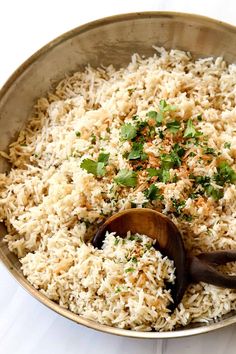 a bowl filled with rice and garnished with cilantro