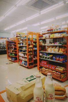 a grocery store filled with lots of food and drinks on the floor next to each other