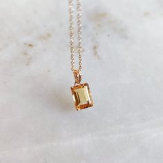 This stunning pendant is set in 14k Solid Yellow Gold with Natural Citrine with utmost precision. It is an unique gemstone pendant for nearly every occasion and is completely hassle-free jewelry. ITEM DETAILS: * GEM: Citrine * GEM SIZE: 6X8mm * GEM SHAPE: Octagon * Gem weight: 1.50 carats * Gold Purity: 14KT  * Gold Weight: 0.43 gram * Total Weight: 0.73 gram The Gold purity is guaranteed and it comes with authentic 14KT gold hallmark. Since my items are handmade, they are absolutely nickel and Elegant Amber Birthstone Necklace For Gift, Elegant Amber Birthstone Necklace, Faceted Citrine Jewelry As Gift, Elegant Orange Emerald Cut Jewelry, Polished Citrine Jewelry Gift, Classic Citrine Pendant Jewelry, Faceted Citrine Pendant Jewelry, Sunny Disposition, Polished Citrine Pendant Necklace