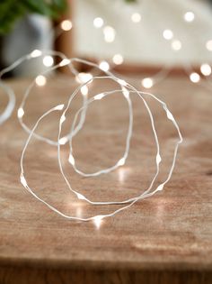 a string of lights on a wooden table