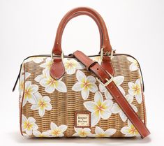 Covered in a fresh, floral design, this coated cotton satchel feels just right for spring. Carry it by the top handles or wear it crossbody with the adjustable strap for hands-free convenience. From Dooney & Bourke. Spring Satchel With Detachable Strap For Daily Use, Daily Use Satchel With Detachable Strap For Spring, Spring Satchel With Top Handle And Leather Handles, Spring Top Handle Satchel With Leather Handles, Floral Print Satchel For Everyday Spring Use, Spring Floral Print Satchel For Everyday Use, Spring Coated Canvas Crossbody Bag, Spring Crossbody Bag In Coated Canvas, Spring Bags With Leather Handles And Coated Canvas