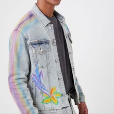 Forever 21 Men Flowrr Denim Rainbow Trucker Jacket. New Nwot. Crafted From Stretch Denim, This Trucker Jacket Features A Striped Sleeve Pattern, Front And Back Painted Flower Design, Basic Collar, Button-Front Closures, Buttoned Chest Flap Pockets, And Dropped Long Sleeves With Buttoned Cuffs. - Matching Bottoms Available. Complete The Look With 00485576. Content + Care - 66% Cotton, 33% Polyester, 1% Spandex - Machine Wash Cold Size + Fit - Model Is 6'2" And Wearing A Medium Brand And Size Tag Removed. Measures Like A Medium. Please Use Measurements For Sizing. Spring Streetwear Denim Jacket, Spring Denim Blue Jacket For Streetwear, Spring Long Sleeve Denim Jacket For Streetwear, Light Wash Denim Jacket For Spring, Spring Light Wash Denim Jacket, Spring Denim Jacket For Streetwear, Spring Fitted Streetwear Outerwear, Fitted Spring Outerwear For Streetwear, Light Wash Outerwear For Spring Streetwear