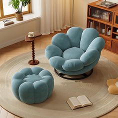 a blue chair and ottoman in a living room