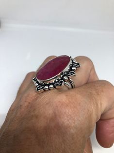 Unusual deep toned raw Ruby low content silver setting handmade size 8 Can be resized. My jeweler charges a $10- $20 fee All rings are shipped in a nice gift box. Check out our over a THOUSAND great reviews Engraving is $4 per letter and is not always perfect depending on the piece. It can take a few days if the jeweler is busy. This is payable to Paypal Judithsltd@gmail.com Handmade Sterling Silver Ruby Ring As Gift, Handmade Sterling Silver Ruby Ring For Gift, Handmade Oval Ruby Ring Gift, Handmade Spiritual Ruby Ring As Gift, Handmade Spiritual Ruby Ring For Anniversary, Handmade Spiritual Ruby Ring For Gift, Handmade Adjustable Oval Ruby Ring, Handmade Adjustable Silver Ruby Ring, Handmade Adjustable Ruby Ring In Sterling Silver