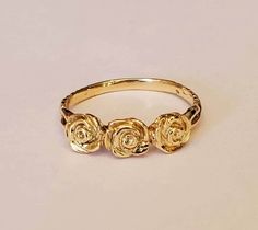 Beautiful hand carved 3 roses ring ring in 14 karat yellow gold 3 roses means I love you Can be ordered in sizes 4 to 10 Can be ordered in yellow gold white gold rose gold and platinum Gold Rings Flower Design, White Rose Ring, Vintage Rose Ring, Gold Rose Ring, Roses Ring, Ancient Greek Jewelry, Three Roses, Greek Jewelry, Casual Jewelry